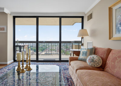 Real estate photography of Alexandria House 1802 living room and balcony